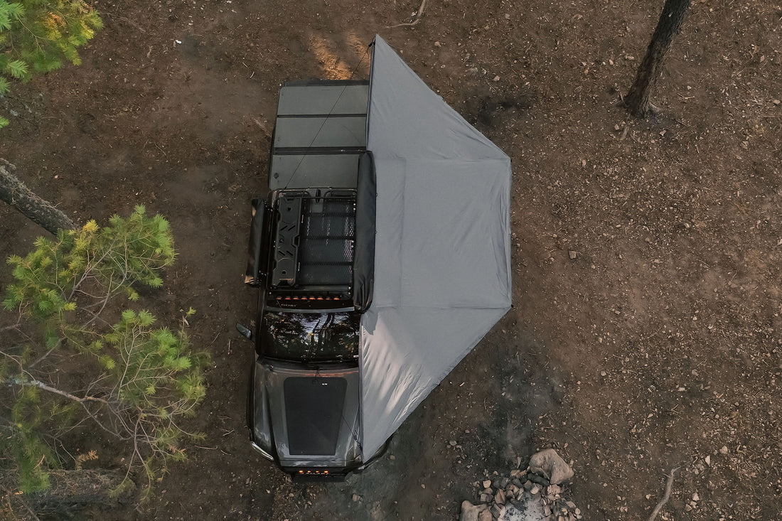 Taruca Rogue 180 awning overhead view of the deployed awning canopy beside a vehicle