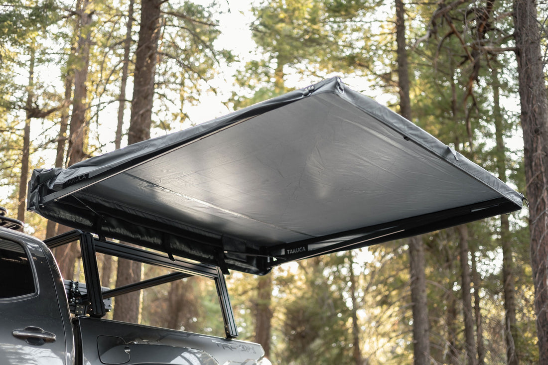 Taruca Rogue 6FT awning canopy deployed beside a vehicle