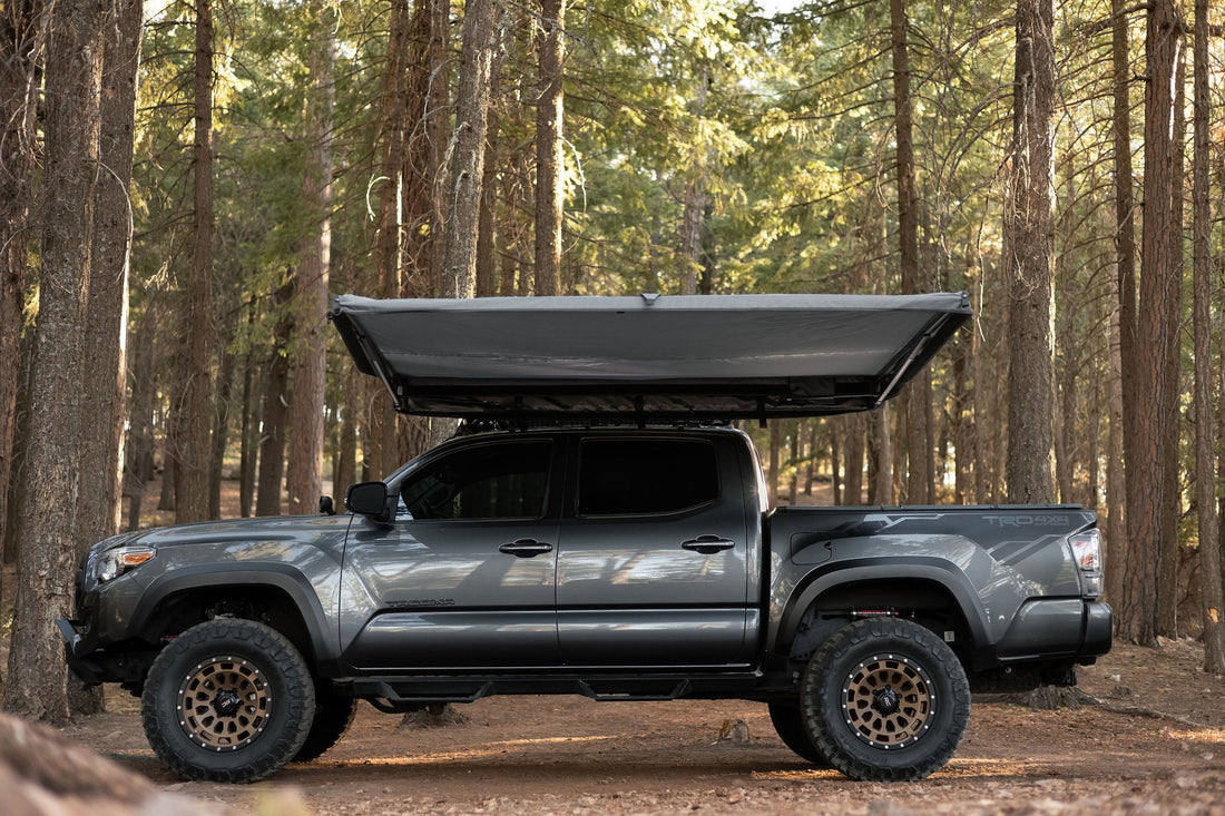 Taruca Rogue 8FT awning canopy deployed beside a vehicle