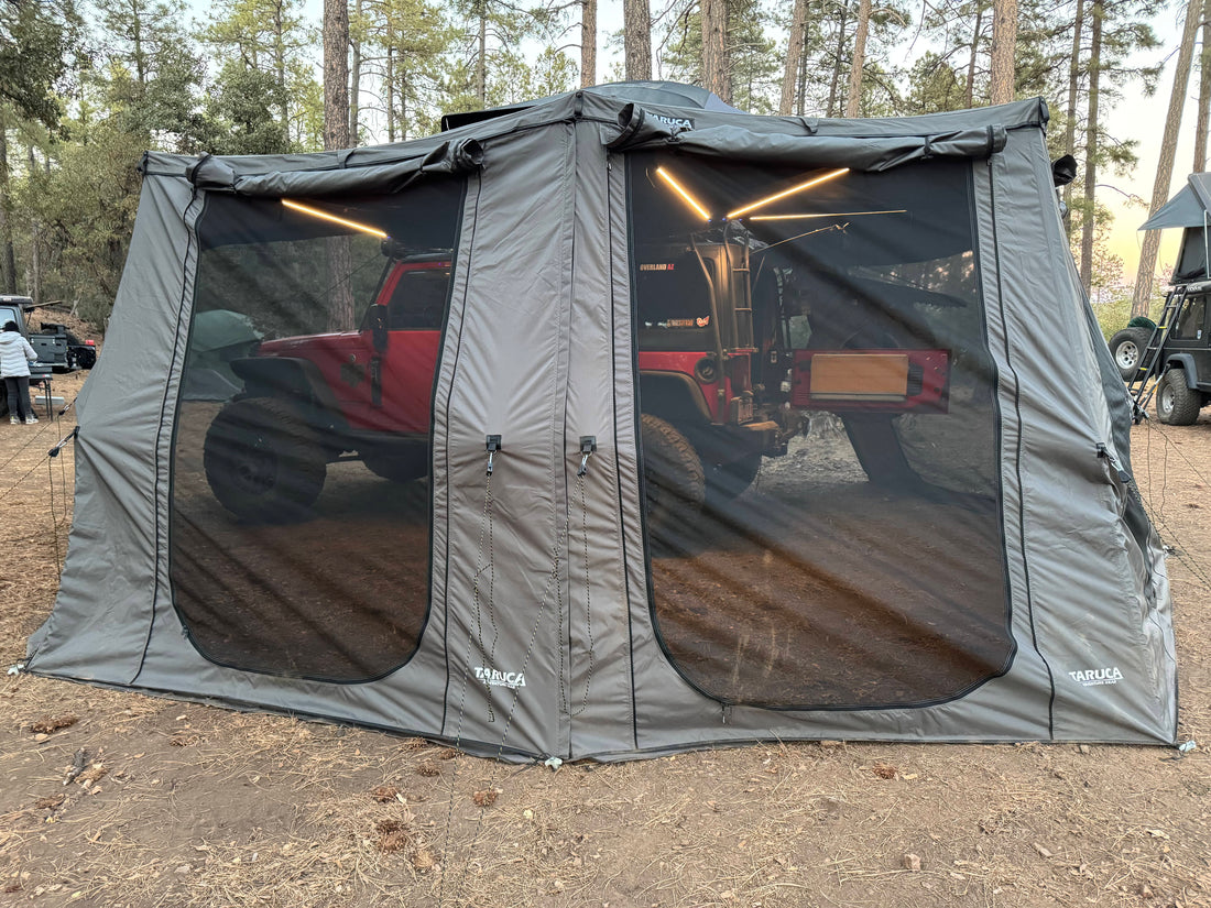 Grey wall kit room attached to a 270+ XC awning in the woods