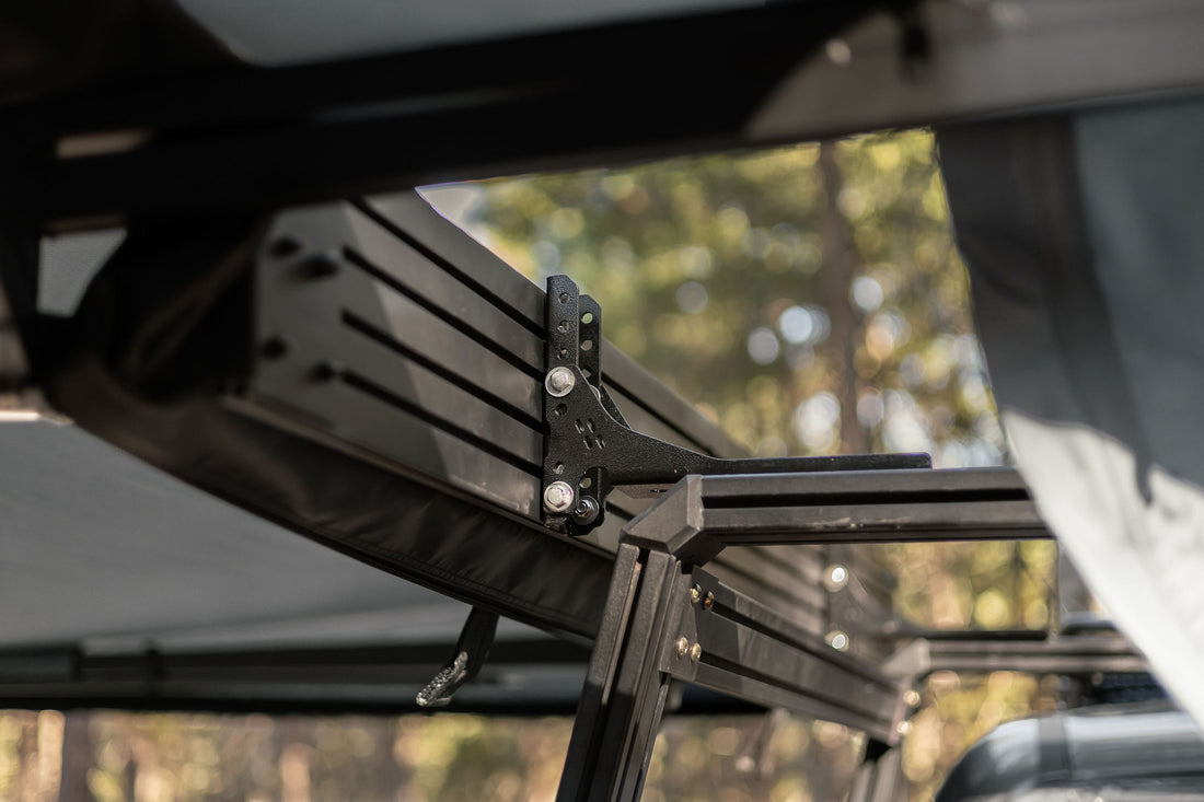 Taruca Rogue 270+ XC D-Access awning close-up of black hinge and mounting bracket hardware