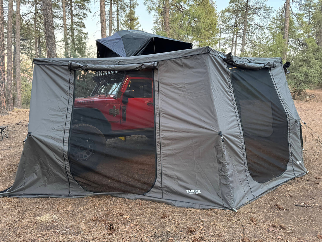 Taruca 270+ XC Outer wall kit with mesh windows attached to the awning on a red vehicle in the forest