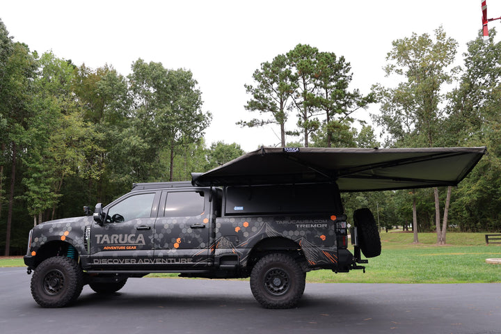 Taruca Rogue 270 S awning side panel extended during setup, driver side profile