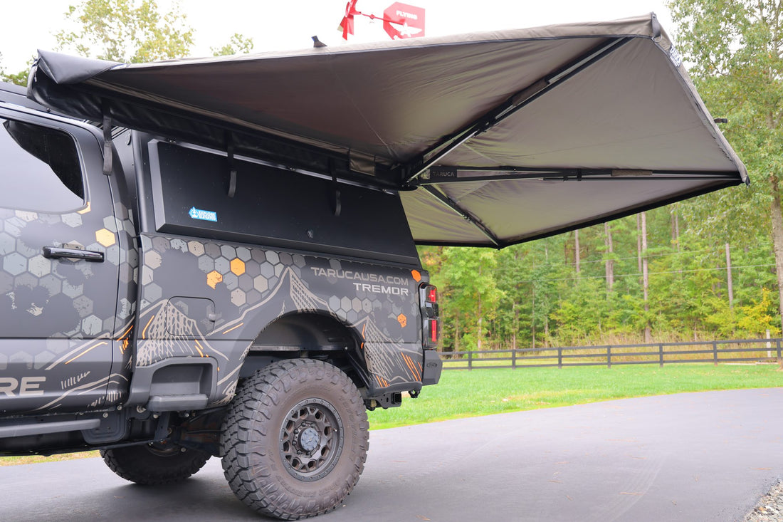 Taruca Rogue 270 S awning dark grey canvas canopy deployed on the driver side